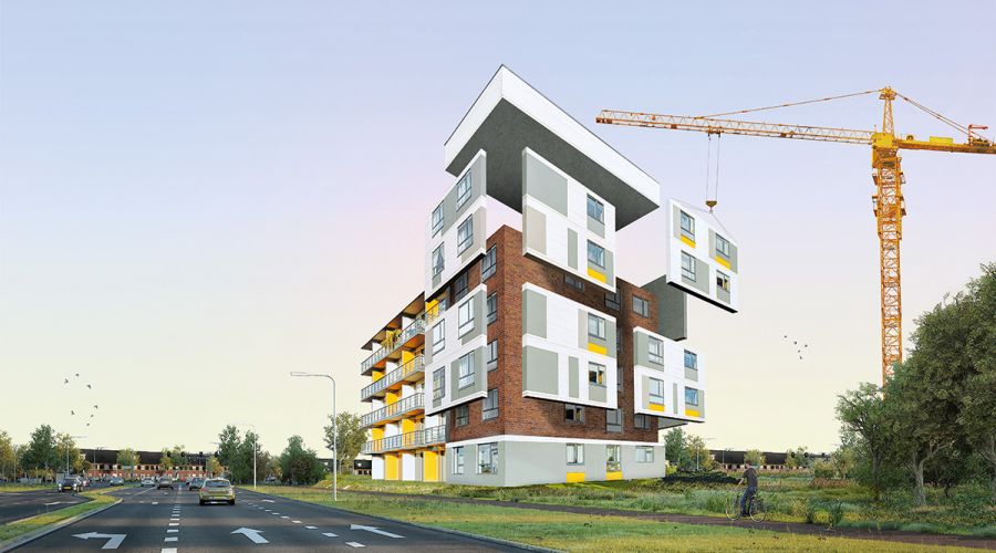 Serielles Sanieren: Die vorgefertigen Bauteile werden mit dem Baukran angeliefert und verbaut